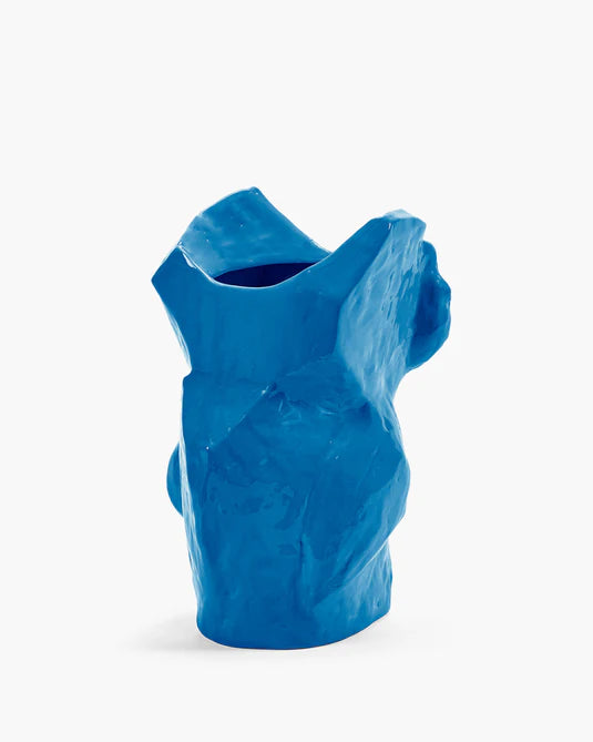 blue ceramic owl vase on white background