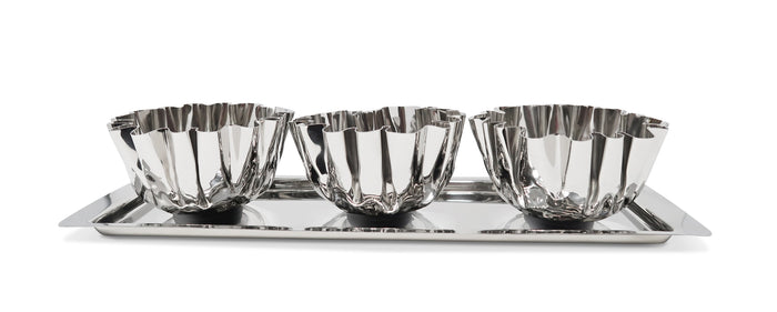Set of three silver bowls on a tray with a white background