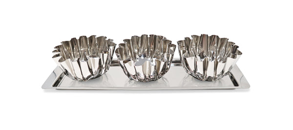 Set of three silver fluted bowls on a tray with a white background