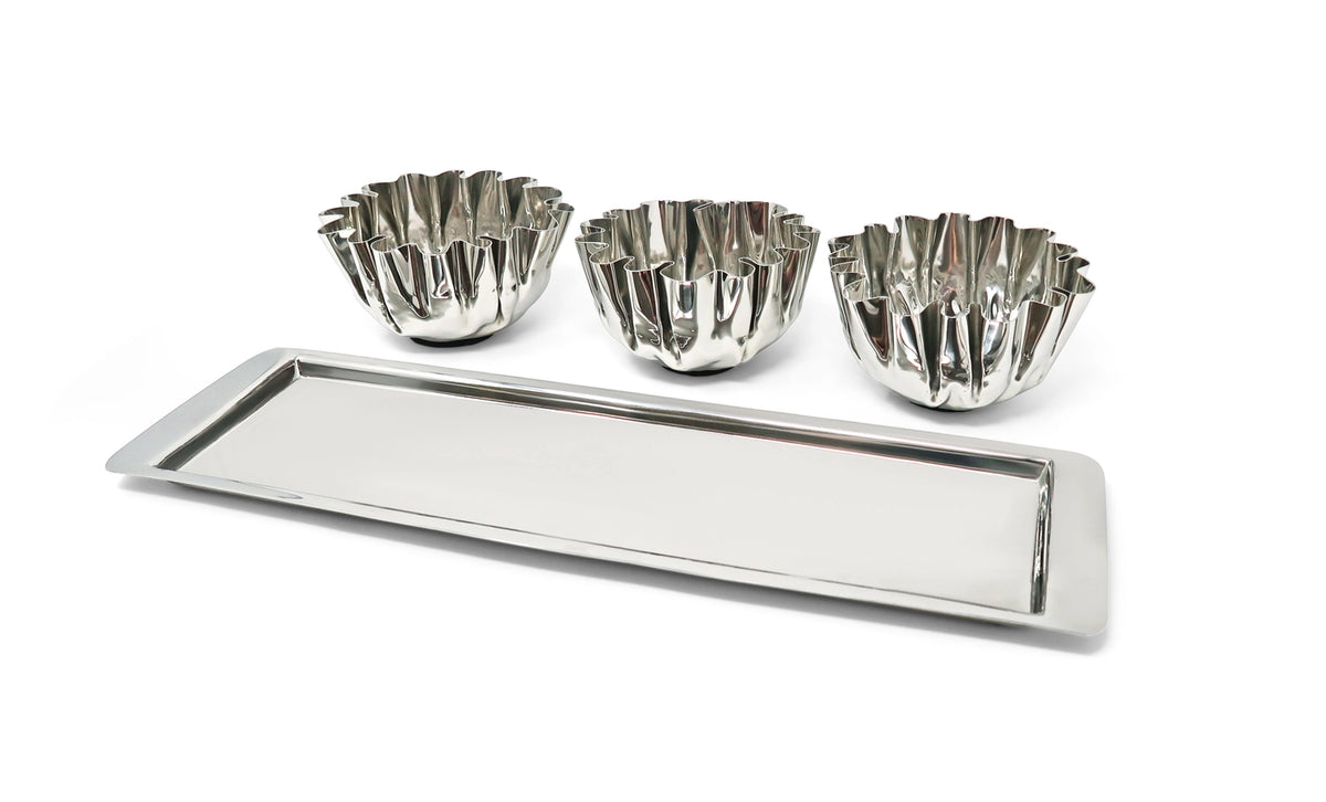 Set of three silver tart tins with a tray on a white background