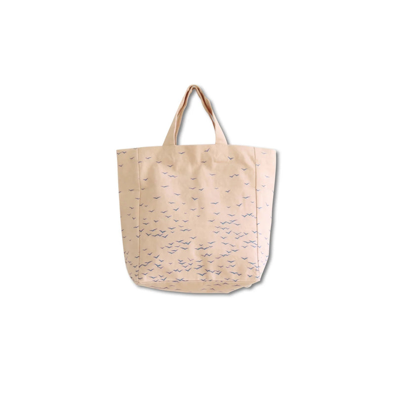 Beige tote bag with birds pattern on a white background