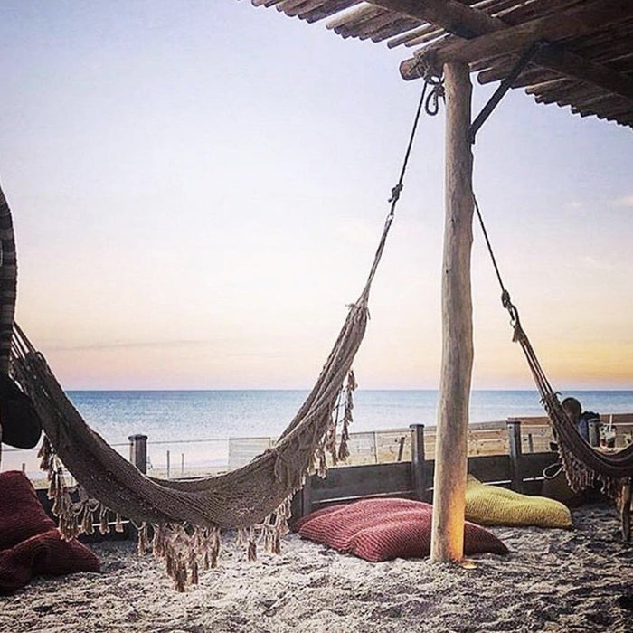 Bohemian hammock with fringes at the beach