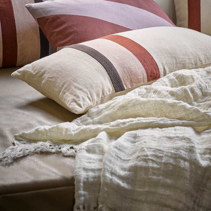 textured cotton throw blanket with pillows