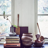 still life setting with natural products and organic shaped wooden spadle