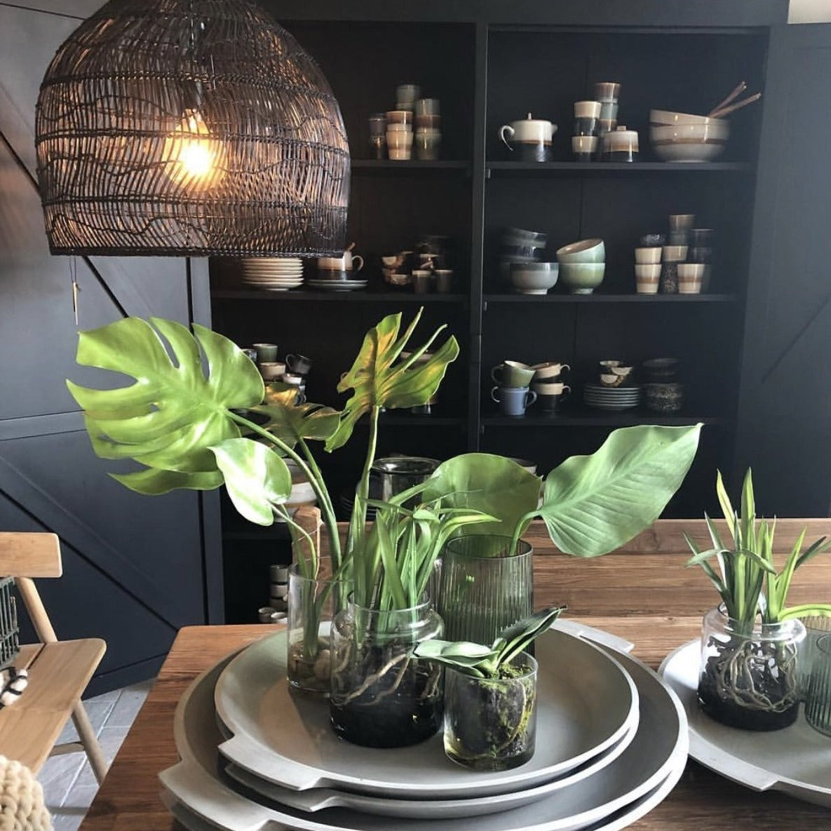 Medium wicker hanging lamp in black in dining room