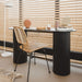 black console table with natural rattan desk chair
