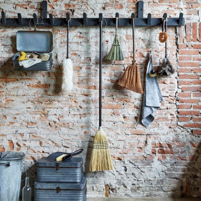 stylish kitchen display with broom and dusting set
