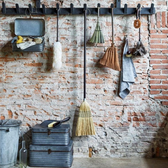 stylish kitchen display with broom and dusting set