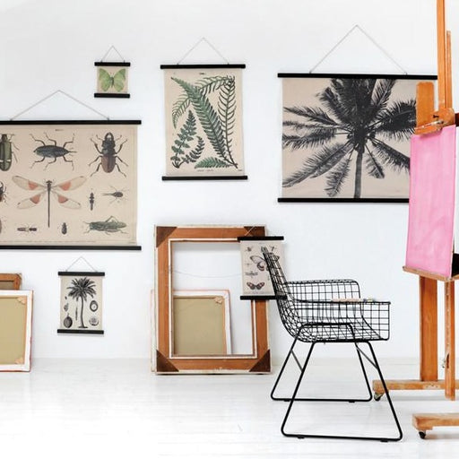 artist studio with cotton wall hangings and empty frames