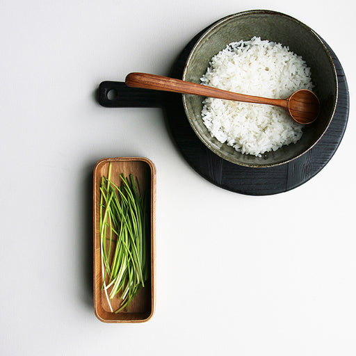 Wooden spoon with rice