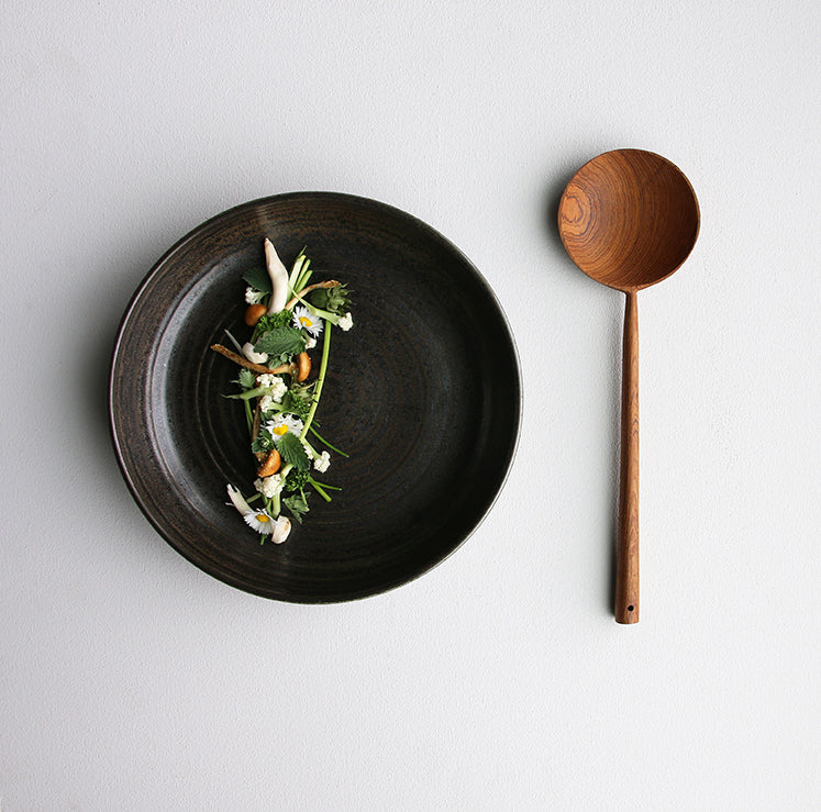 Culinary food with wooden ladle