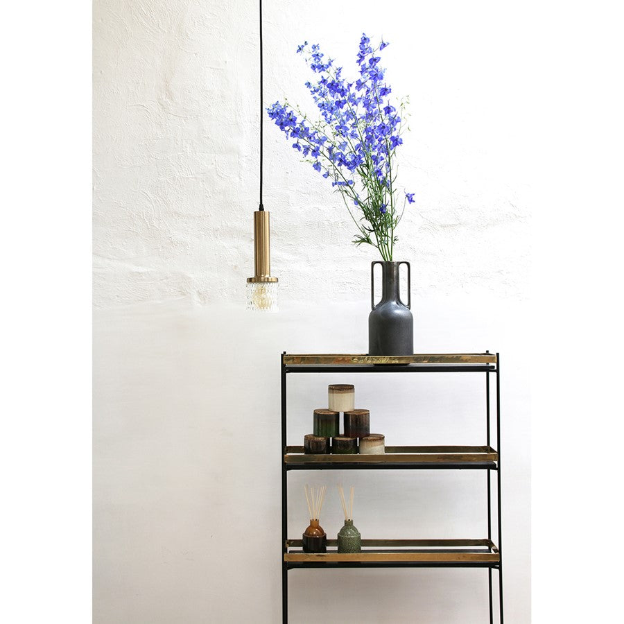 open shelf cabinet with black ceramic vase with handles and blue flowers