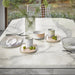 table setting with one of Set of 2 clear ribbed glass vases by HK living USA for flowers