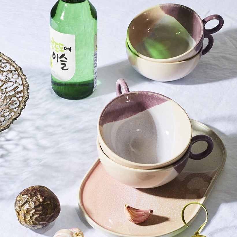 tea cups made of pastel colored ceramic