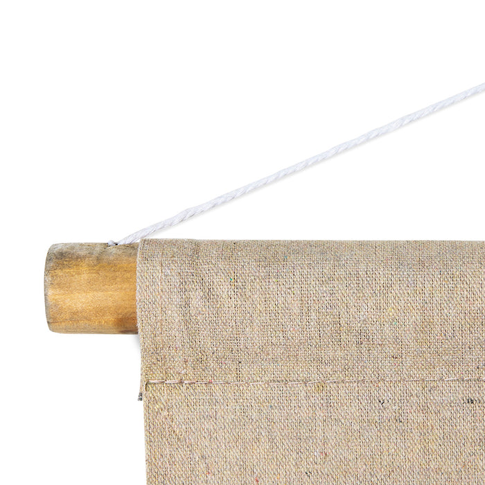 detail of rod with cotton wall hanging