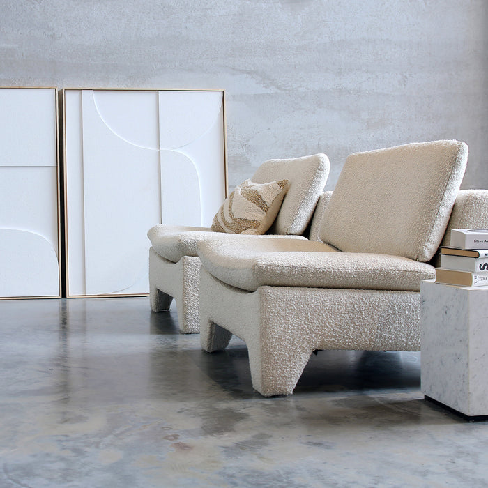 two retro lounge chairs with marble side table and big white art works with frame by Frame Products