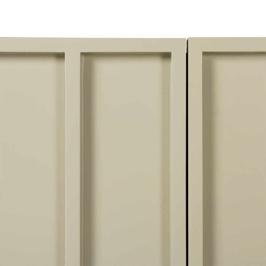 detail of door made from mdf wood in sand color with green undertone
