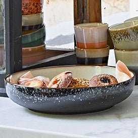 large black speckled serving bowl with cookies