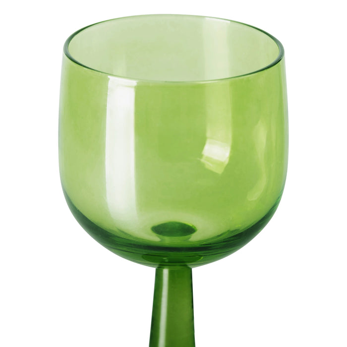 detail of tall stem lime green wine glass