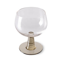 wine glass with a green colored low stem 