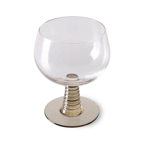 wine glass with a green colored low stem 