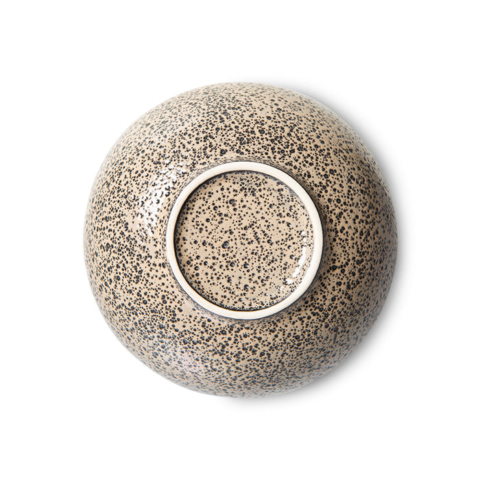 stoneware bowl in taupe color with dark speckles