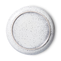 back of a round stoneware speckled deep plate