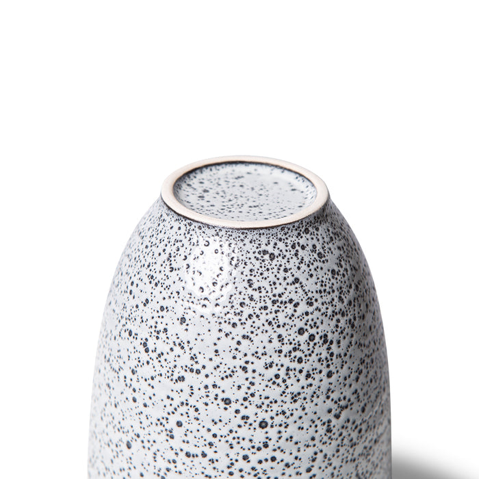 bottom of white speckled stoneware tumbler mug