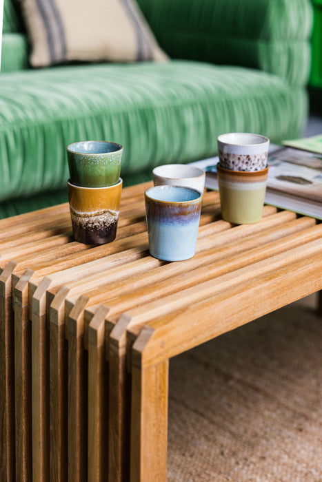teak wooden slatted coffee table with green, orange, blue and cream colored stoneware retro style coffee cups