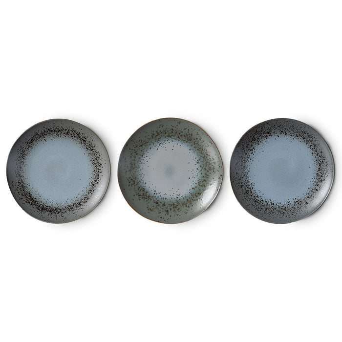 three stoneware plates with variations in outcome 