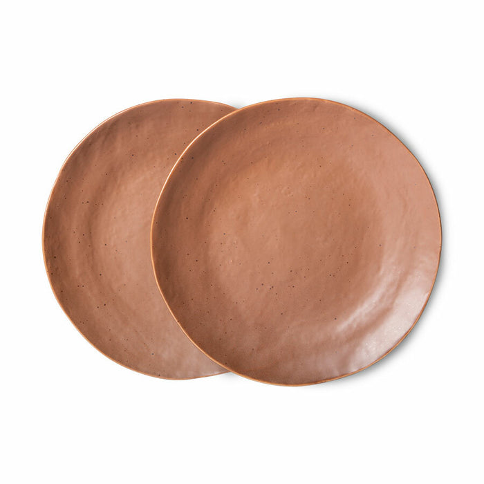 two porcelain brown colored side plates with a terra undertone