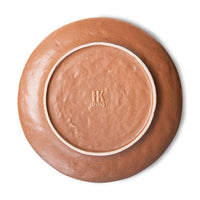 back of colored side plate with a terra undertone