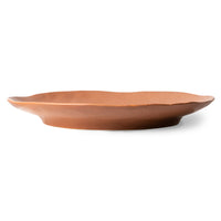 colored side plate with a terra undertone