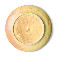 back of organic shaped side plate in yellow with brown accents