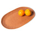 brown oval shape serving platter with two oranges
