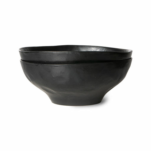 two organic shaped black bowls