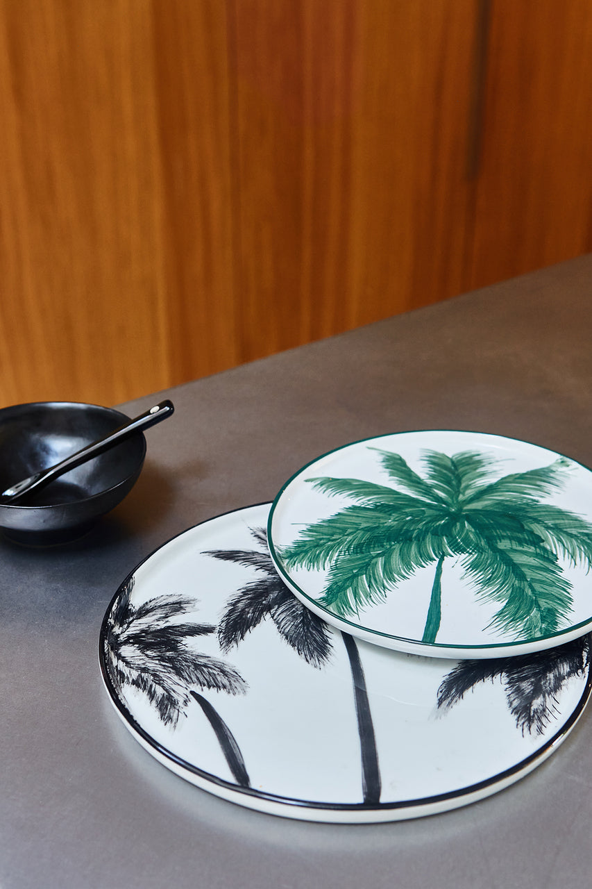 palm tree plates and black porcelain bowl 