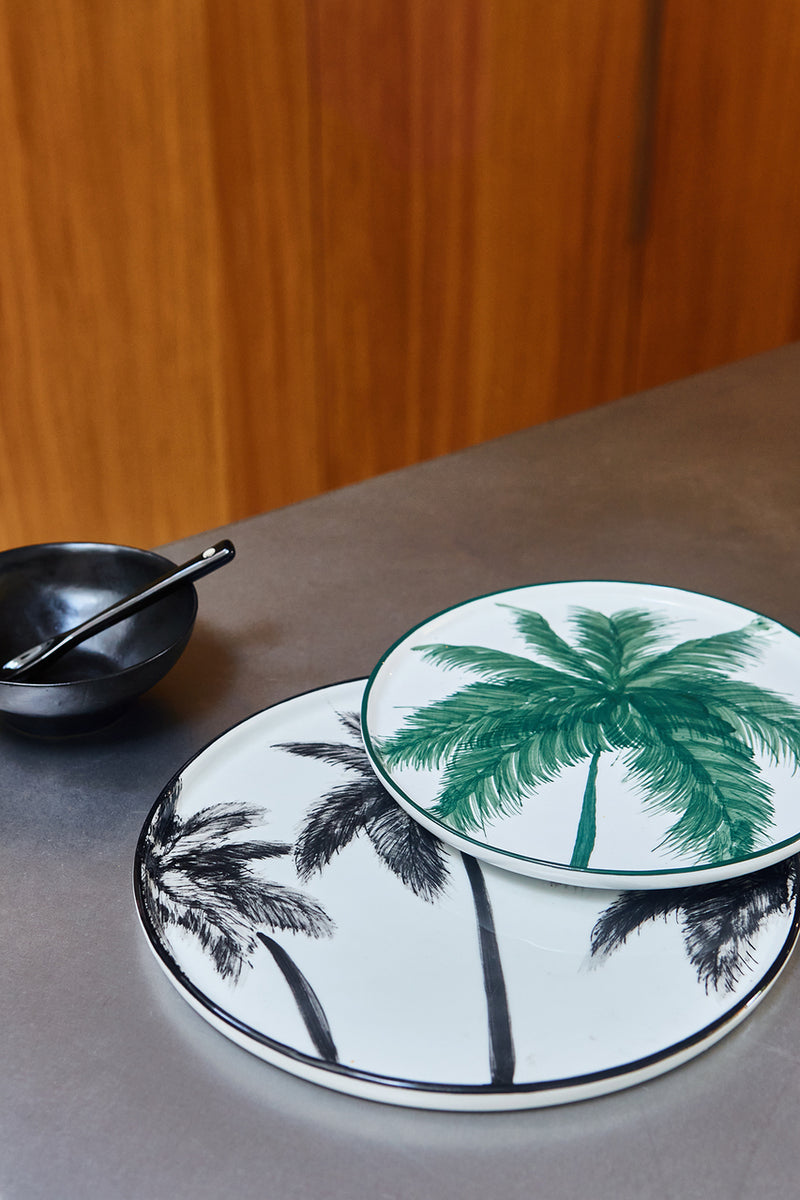 palm tree plates and black porcelain bowl 