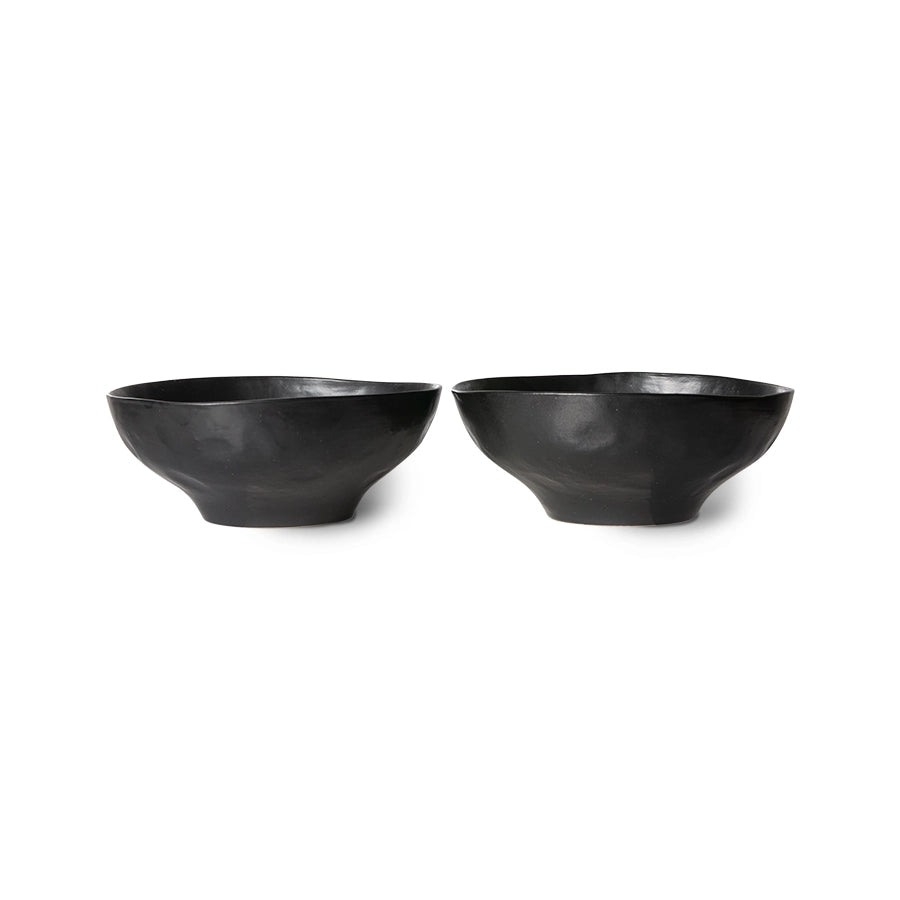 two organic shaped black bowls