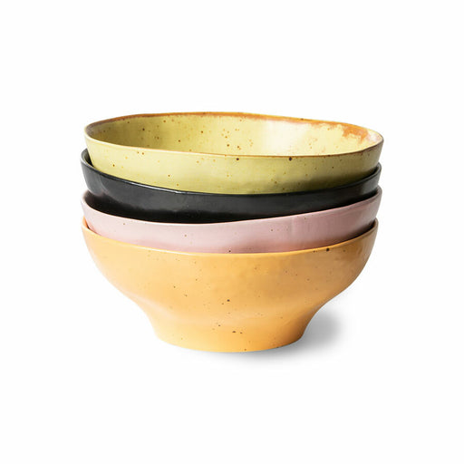 yellow, black, pink and orange organic shaped bowls in a stack