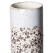 detail of retro style stoneware tall flower vase in light blue with brown and white pattern