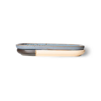 set of 2 organic shaped  small stoneware trays in blue, black, orange and purple colors stacked