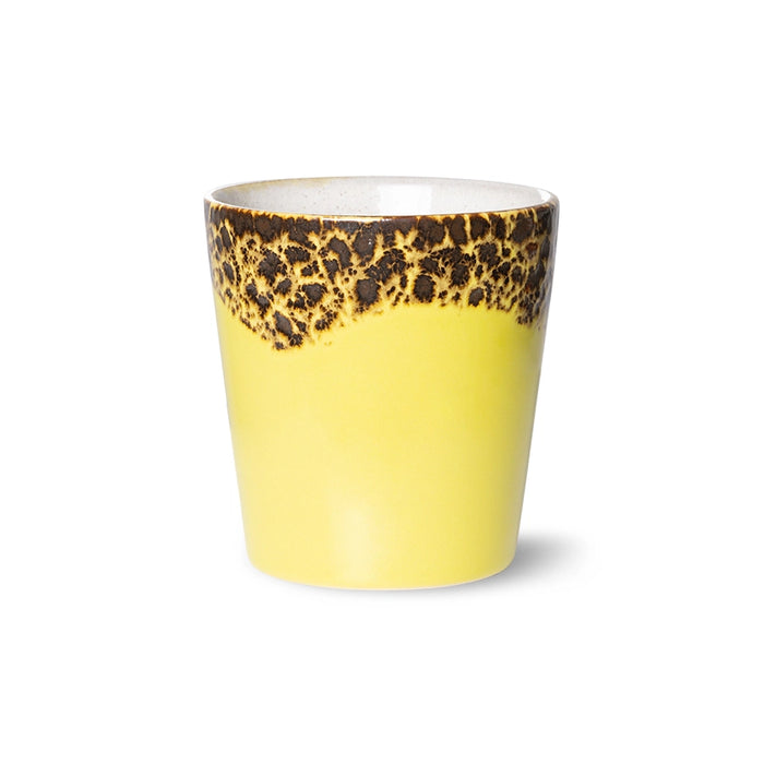 yellow and brown stoneware coffee cup