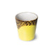 yellow and brown stoneware coffee cup