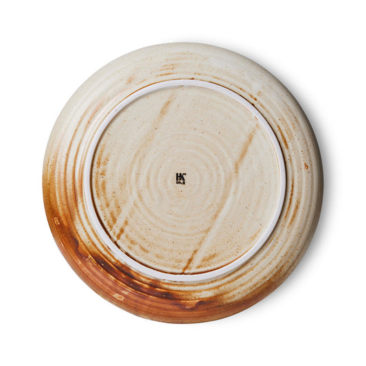 back of cream and brown round porcelain side plate