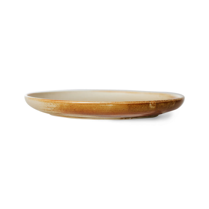 cream and brown round porcelain side plate
