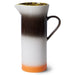 tall stoneware pitcher with orange, white and brown finish