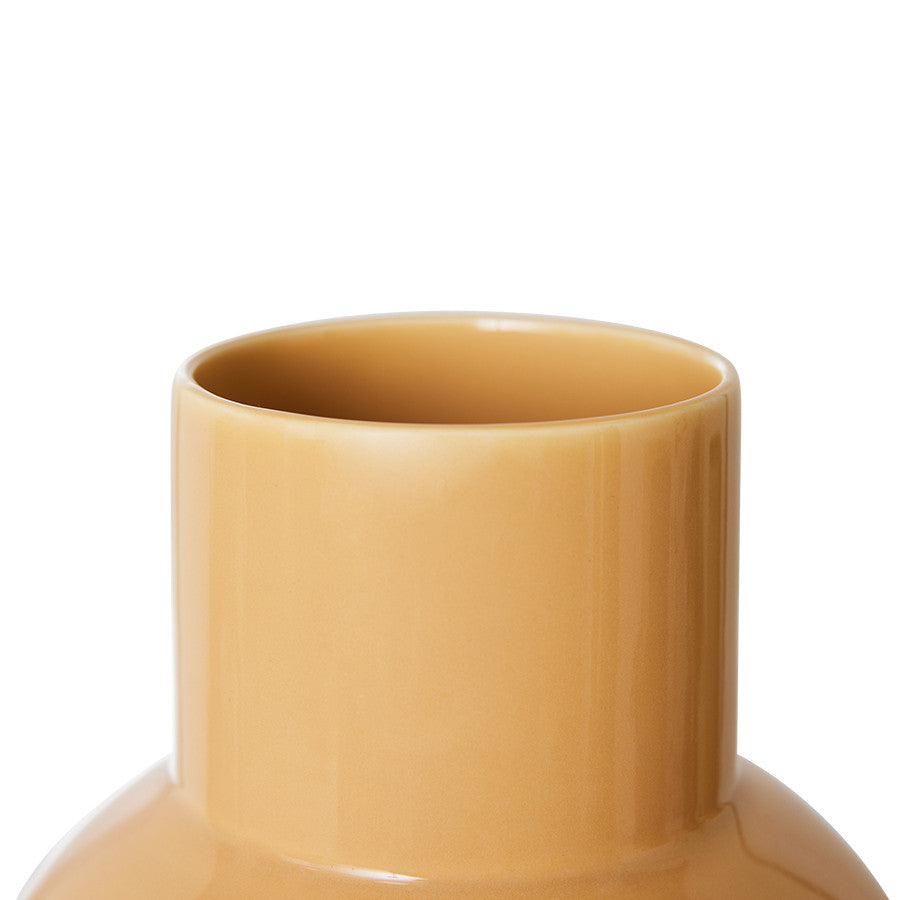 detail of cappuccino brown colored round flower vase