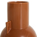 detail of a small elegant caramel brown flower vase 