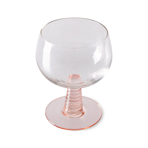 low stem wine glass with a pink foot